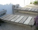 Day beds constructed from surplus weathered teak