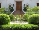 A raised pond re-inforces classical symmetry in the front entranceway